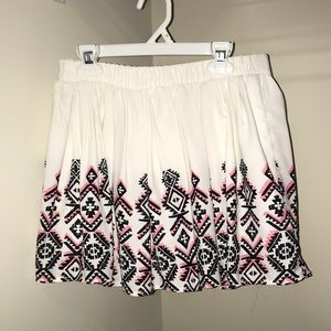 white skirt with pink and black accents